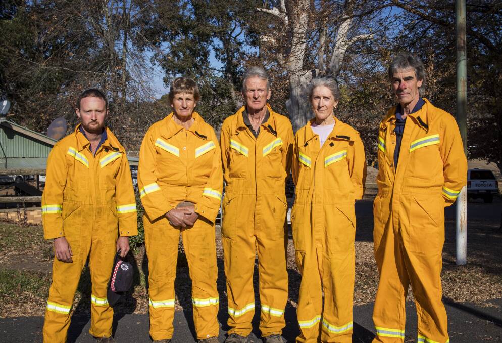 Dederang CFA volunteers Bill Yea, Chris Hicks, John McEvoy, Sharon McEvoy and Paul Northey wore their uniforms to the meeting. Picture by Layton Holley