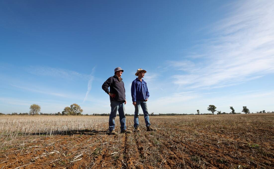 Urangeline East farmers Rick and Tom Clancy inspect their property earlier this month. Picture by James Wiltshire