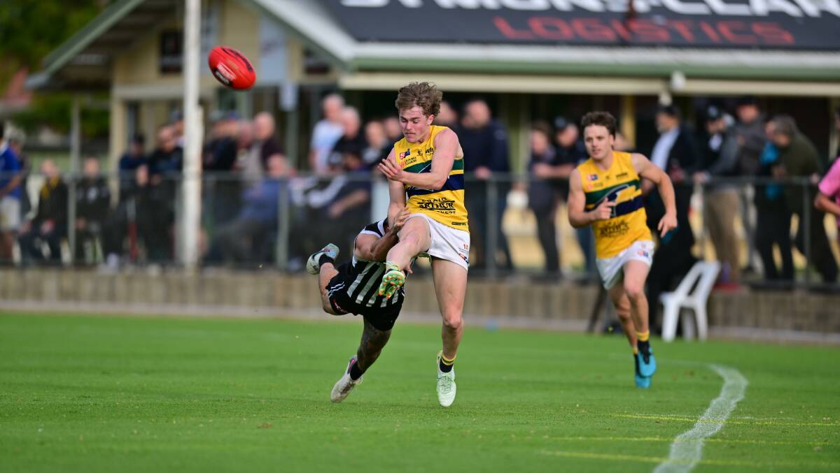 Beattie gets a kick away against Port Adelaide at Alberton Oval last month. Picture by Scott Starkey
