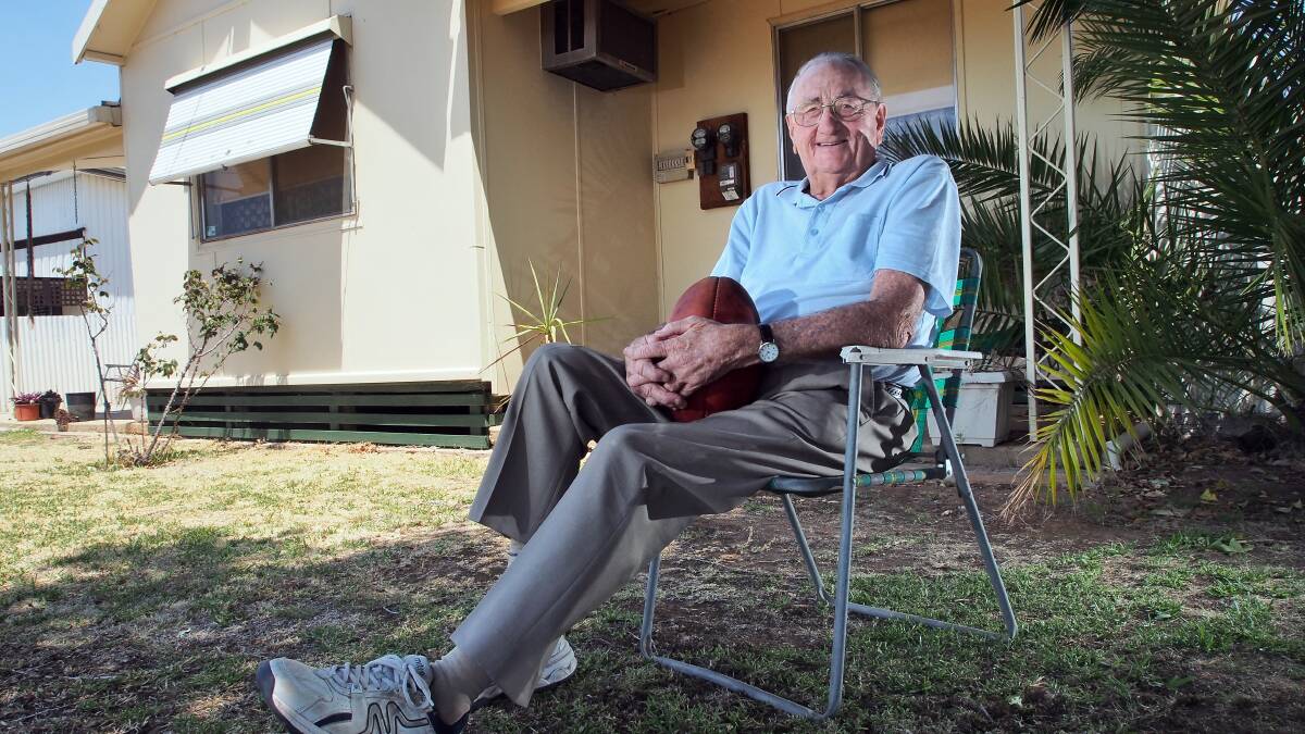 John Voss at home after receiving the Order of Australia Medal in 2013. Picture by Ben Eyles