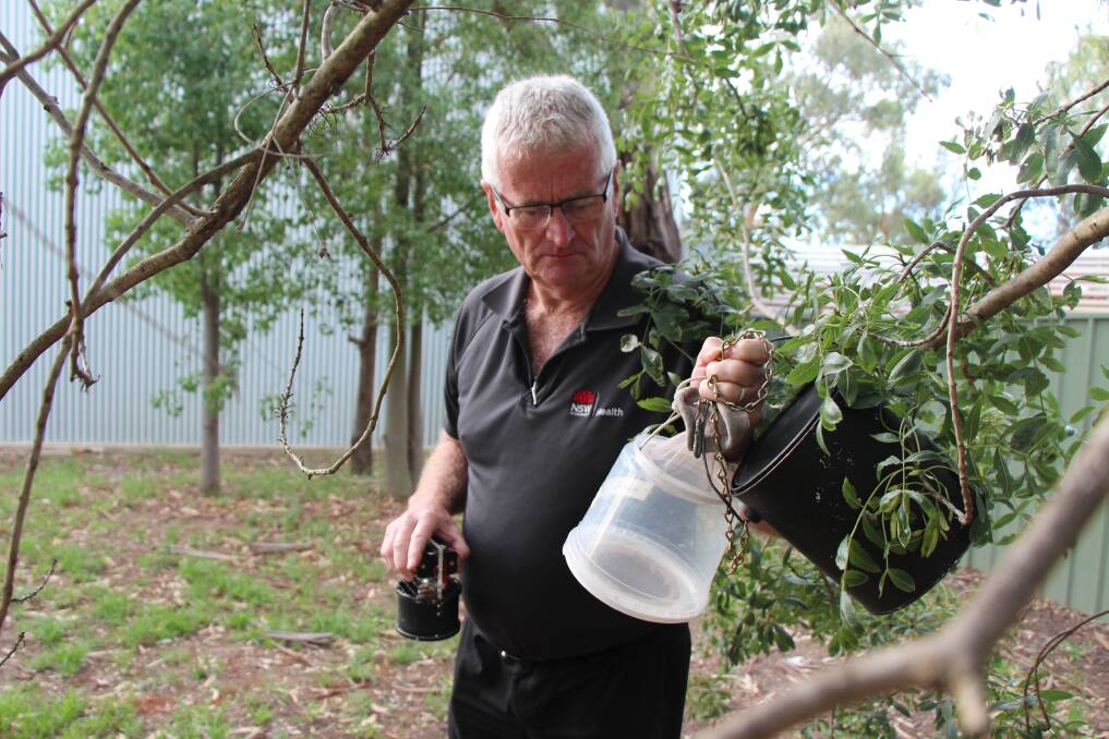 Tony Burns, senior environmental health officer with Murrumbidgee Health operating the mosquito traps. Picture by Andrew Pearson. 