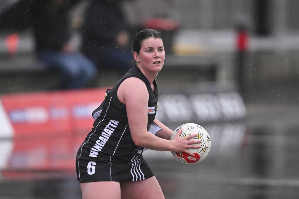 Wangaratta's Chaye Crimmins caught in the rain during her side's win against North Albury at Norm Minns Oval on Saturday. Picture by Mark Jesser