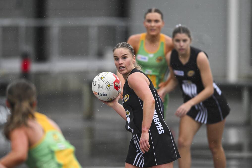 Wangaratta midcourter Issy Newton with possession of the ball against North Albury as rain fell at Norm Minns Oval on Saturday. Picture by Mark Jesser