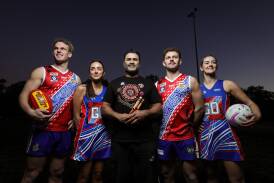 Luke Gerecke, Amelia McAlister, Derek Murray, Tom Rake and Giaan Collings showcase Thurgoona's NAIDOC Round uniforms and traditional Indigenous clap sticks ahead of this weekend. Picture by James Wiltshire