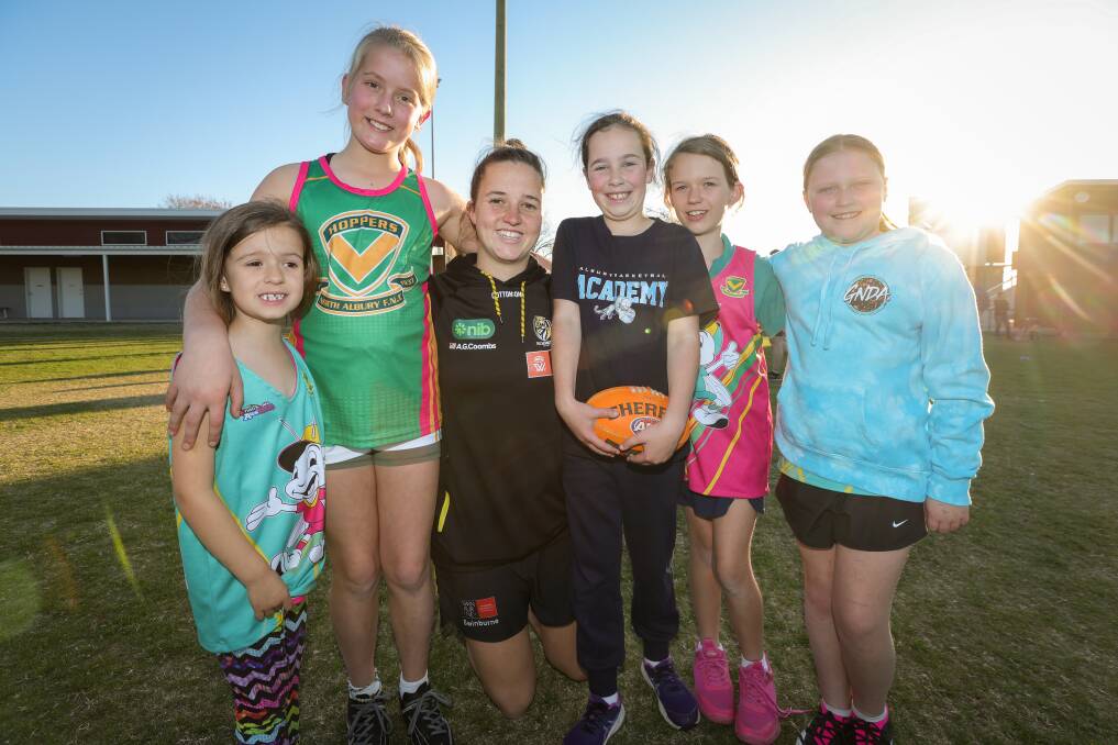 Georgia Litchfield, 6, and Bella Hurcum, 10, were excited to meet Richmond player Amelia Peck, alongside fellow participants Amelia Brear, 9, Tessa Litchfield, 9, and Dulcie Margery, 9. Picture by James Wiltshire