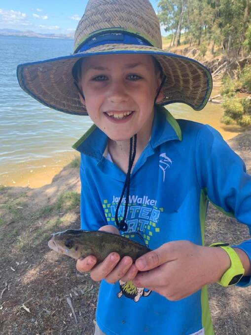 SEEING REDDIES: Ben Rahaley, 10, with another ripper redfin at the weir. Reddies are on the troll and can be tempted by a variety of options including bait, flicking vibes or blades or plastics.