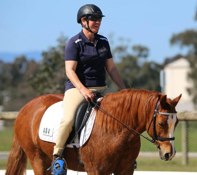HAPPY DAYS: Albury’s Mona Helmgens and Greenwood Sorcerer appear pleased with their efforts in the level 4 dressage. 
