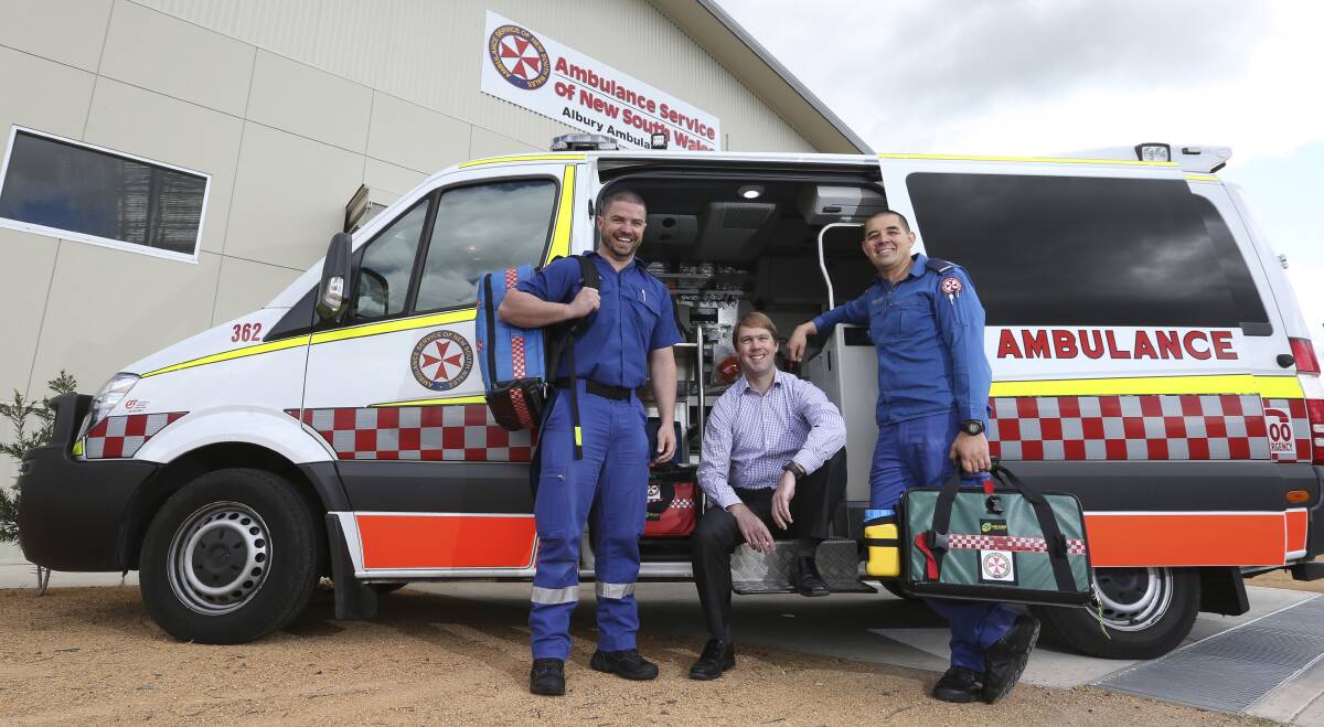 ALWAYS READY: NSW paramedics Luke Allsop and Jason Kydd with Steven Swann at Albury ambulance station.  Pictures: ELENOR TEDENBORG