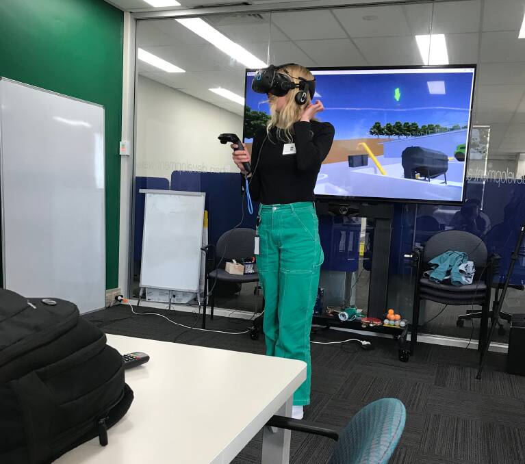 Zoe Stamp at the virtual reality session at the GHD office in Wodonga.