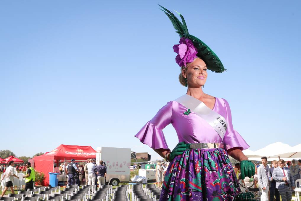 LABOUR OF LOVE: Griffith sonographer Elizabeth Paterson won Lady of the Day with her own creation, a lilac and green outfit and headpiece. Pictures: JAMES WILTSHIRE