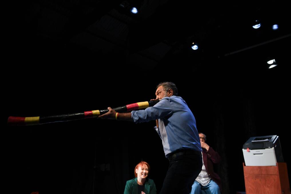 Billy McPherson on the didgeridoo as Rachel McNamara and Lisa Maza look on. Picture by Tara Trewhella