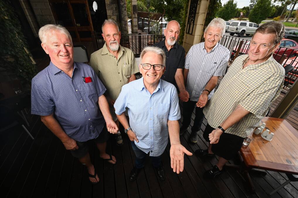 ZIPPER CLUB: Wodonga entertainer Rodney Vincent (centre) and (from left) Stephen Buckle, Brian Webb, Sam Vonthien, Des Richardson and Ron Montgomery reveal their arm scars courtesy of open heart surgeries. Pictures: MARK JESSER