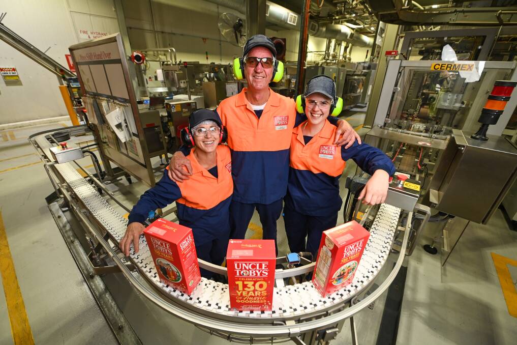 Long-serving Uncle Tobys employee Jack Landgren, with his colleagues Belinda Foster and Tullia Hutchinson-Sharp, celebrate the company's 130th anniversary this year. Pictures by Mark Jesser