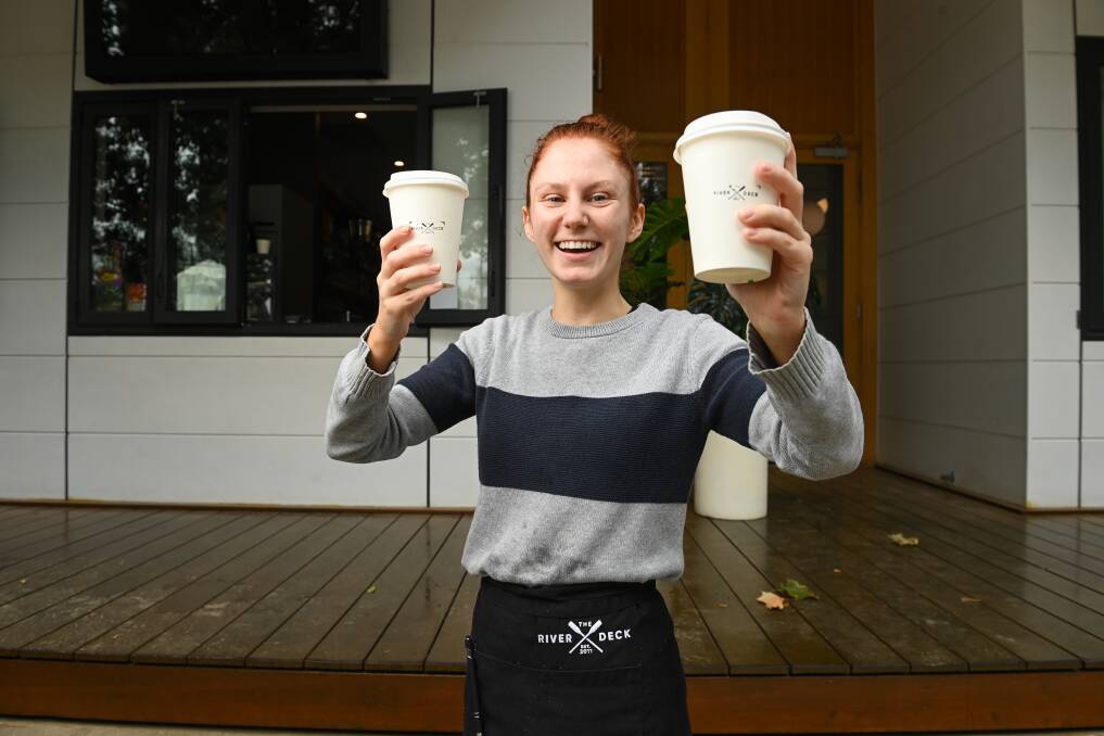 Barista Molly Burke serves takeaway coffee and snacks at The River Deck in South Albury. Picture by Mark Jesser