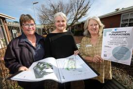 Tallangatta Health Service environmental services manager Estelle Star, Websters Estate owner Jo Wade and Tallangatta Health Service chief executive Vicki Pitcher with plans for the Lakeview Sensory Garden. Picture by James Wiltshire