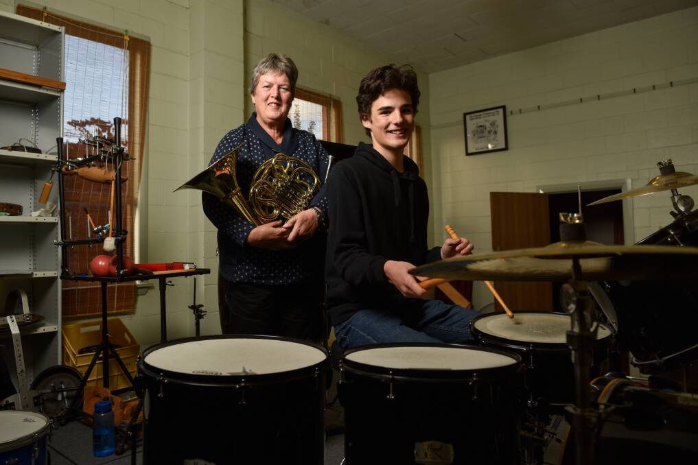 Border Music Camp attendee and "camp mum" since 1992, Heather Street, and student camp attendee Rory Baines, 15, who are also Albury City Band members, welcome the return of the annual camp to the July school holidays in Albury. Picture by Tara Trewhella