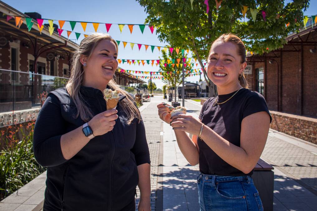 Wodonga Council events team leader Paige Dalley and communications team leader Alexandra Gibbs prepare for the weekend's festivities. Picture by Layton Holley