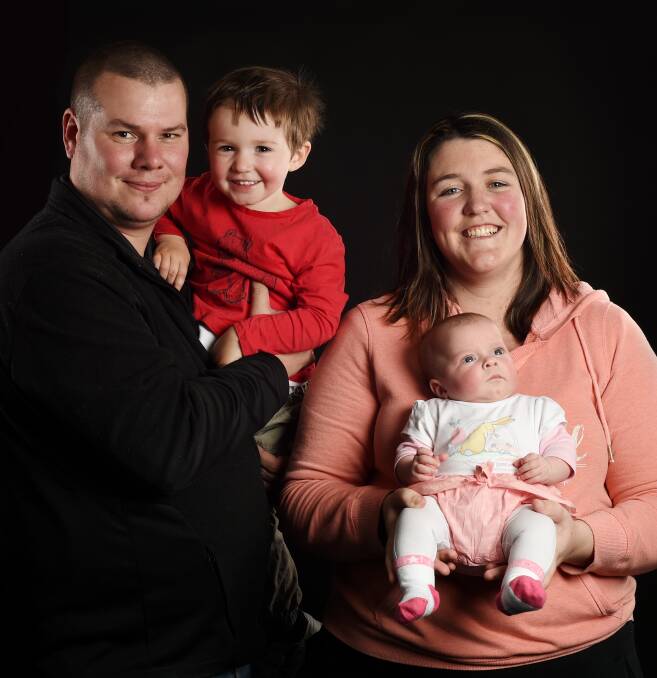 FAMILY PORTRAIT: Andrew Lee and his partner Laura Shanahan with their children Xavier, 2, and baby Savannah, who weighed less than 2 kilograms when she was born in Wodonga Hospital on June 10. Picture: MARK JESSER
