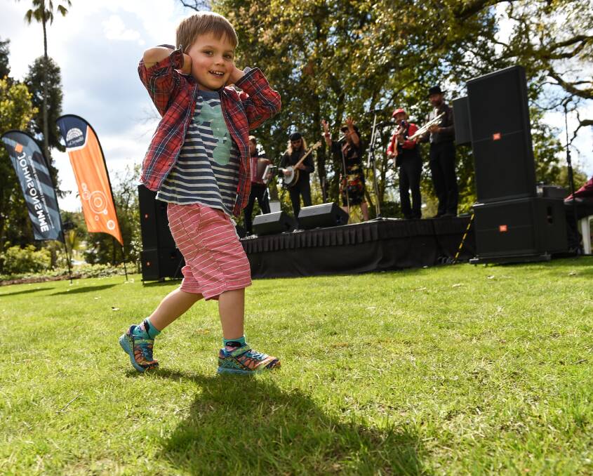 Tiny dancer: Isaiah Rogalski, 4, of Albury, was up and about during Music in the Gardens, dancing to the music of gypsy band Lolo Lovina at Albury Botanic Gardens on Sunday. Picture: MARK JESSER