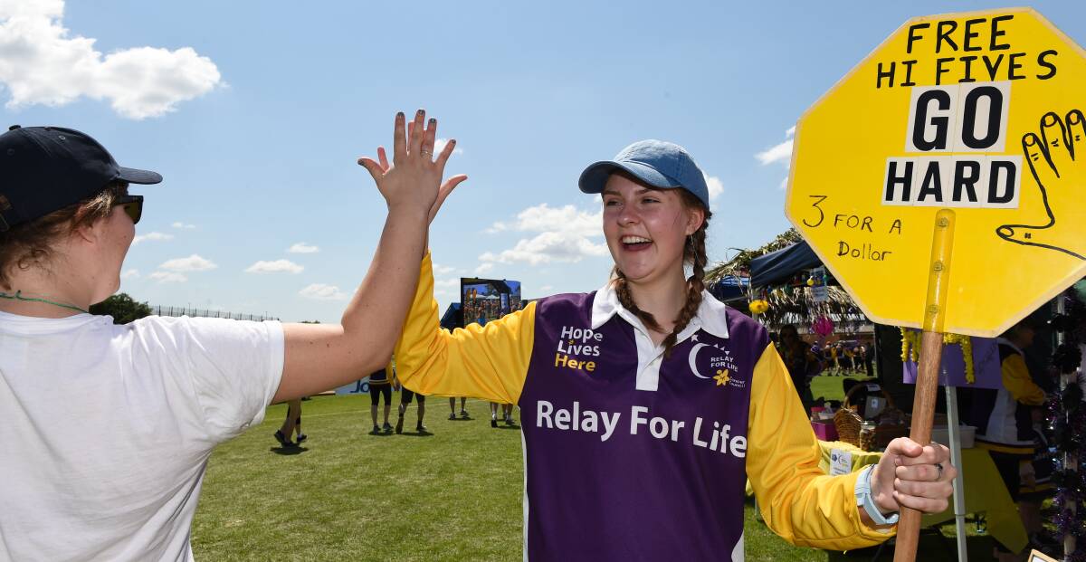 UP HIGH: Lauren Eddy, 15, was part of creating a positive community feel during Relay for Life at Alexandra Park by giving out free high fives with a smile.