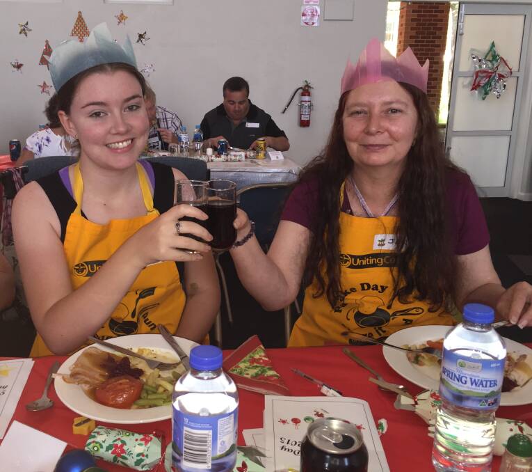 CHEERS: Alana Hill and Jen Thorsen were both first-time volunteers at Wangaratta's Uniting Church. Picture: SHANA MORGAN