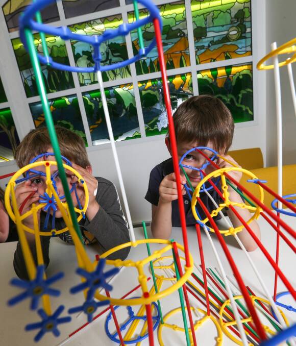 Little engineers: Declan Rivers, 7, and Archie Showers, 7, got creative during the school holidays at Lavington Library in the Connecta construction zone. Picture: JAMES WILTSHIRE