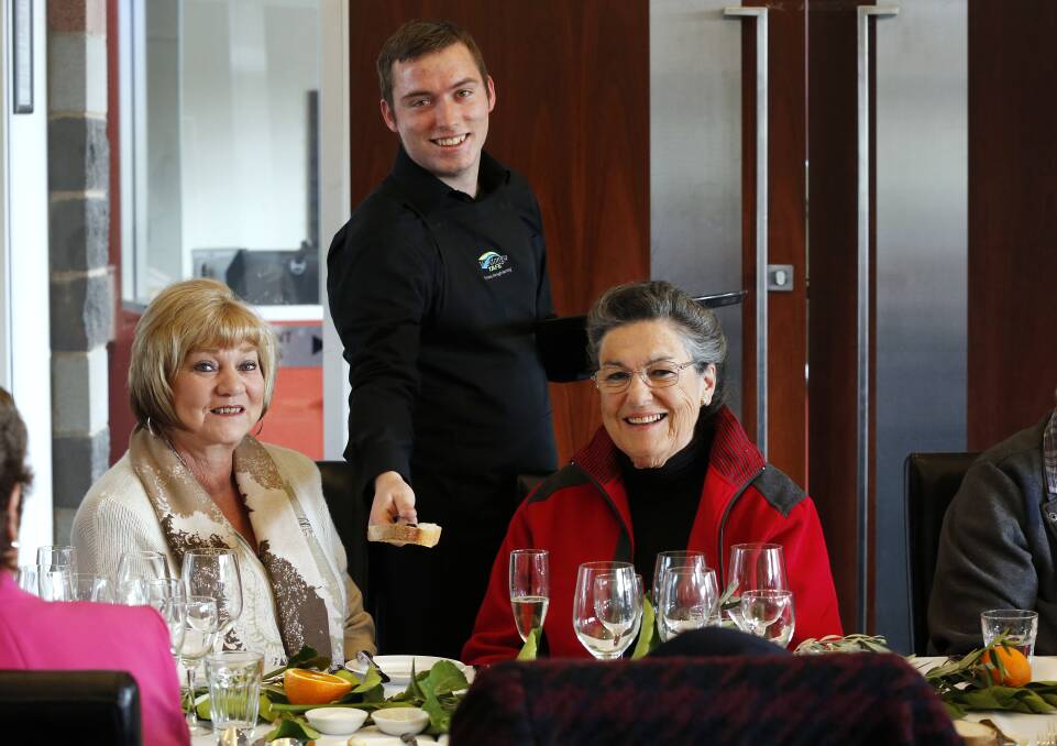 TOP SERVICE: Student Josh Hugall serves diners Tina Jones, of Lavington, and Robyn McEachern, of Wodonga, during the five-course French Winter Feast.