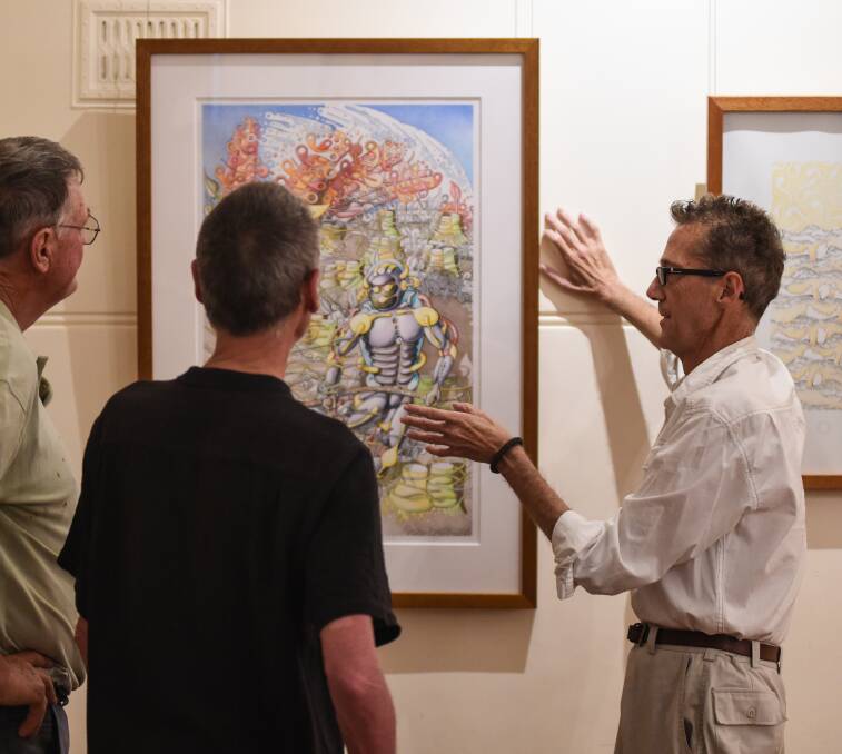 DELICATE TOUCH: Peter Smithwick prepares his exhibition at The Albury Club. Pictures: MARK JESSER