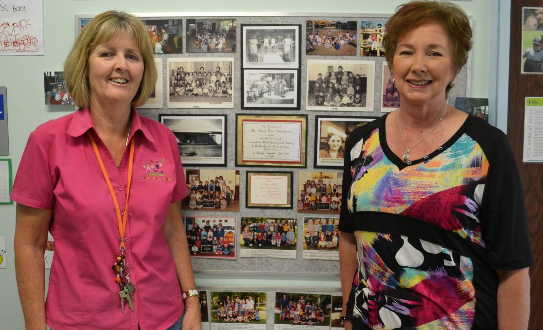MEMORY WALL: Gabrielle Connell inspects the history wall with Laraine Medwell nee Howard, who attended Albury Preschool in Kiewa Street in 1954.