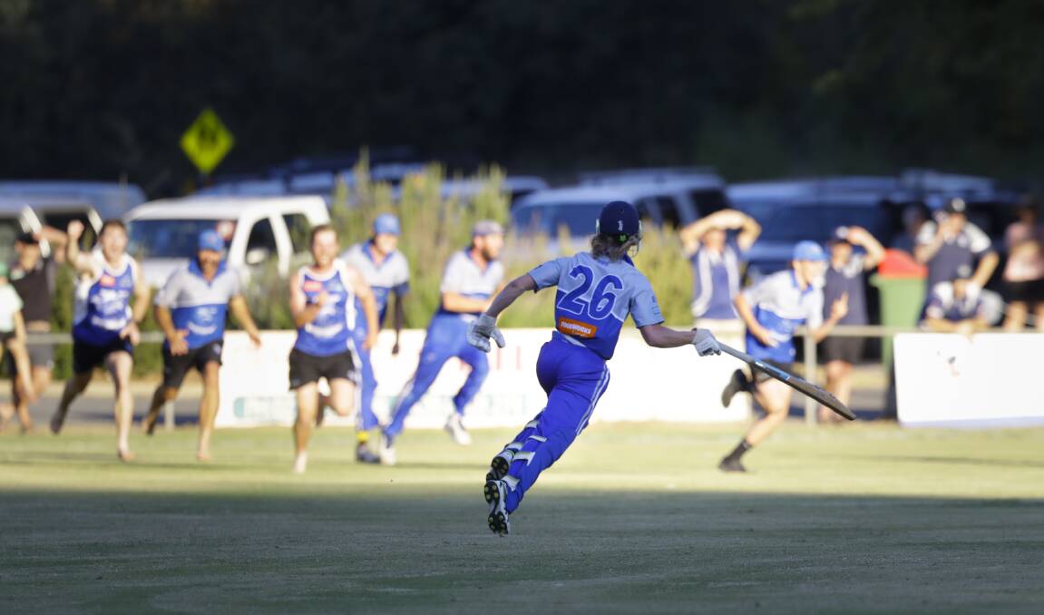 WHAT DREAMS ARE MADE OF: Young Roo Lachlan Martin celebrates scoring the winning run which saw his side become back-to-back premiers at Yackandandah.