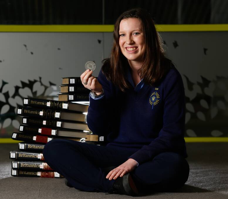 STATE WINNER: Catholic College Wodonga student Kate Johnston, 16, scored the highest mark in Victoria in the Australian History Competition 2015. She was awarded a medallion for her achievement. Picture: MARK JESSER 