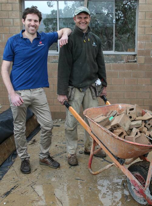 HEAVY LIFTING: Flex Out Physiotherapist Liam James helps builder Rob Tuksar work safely on site as part of Tradies National Health Month. Tradies are encouraged to seek help for health problems. Picture: ELENOR TEDENBORG  