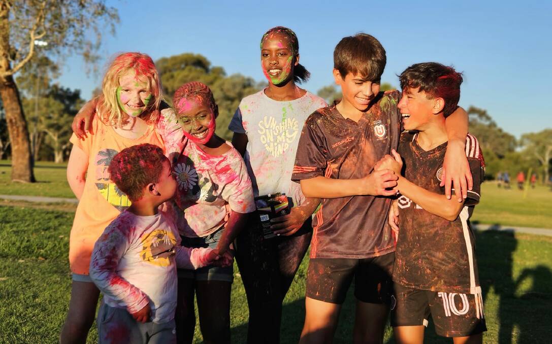 United colours of harmony ... Tully Heath, sisters Favour and Sascha Budederi, brothers Loau and Radwan Alabed, and young Evann Ekici prepare for the colour run at Sunday's Harmony Day celebrations at Willow Park, Wodonga. Picture supplied