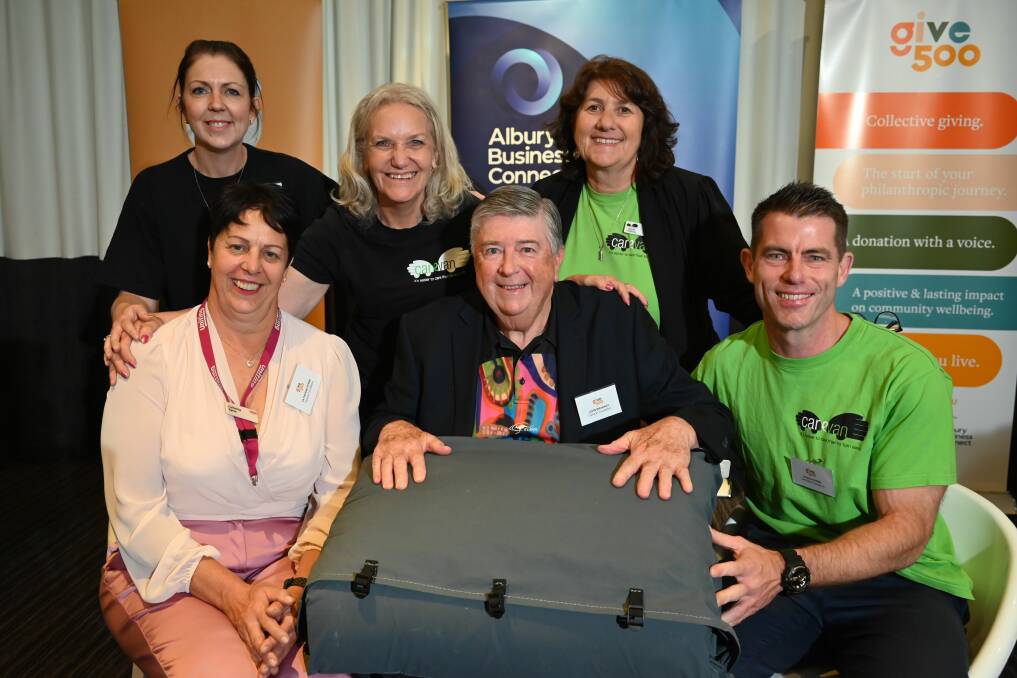 Carevan founder John Brabant with (left) Uniting Wodonga's Catherine Byrne, Carevan CEO Leanne Johnson and crew at Wednesday night's Border Trust Give500 event where they were announced the winners of an $18,000 grant for a backpack swag to help the homeless. Picture by Justin Dallinger