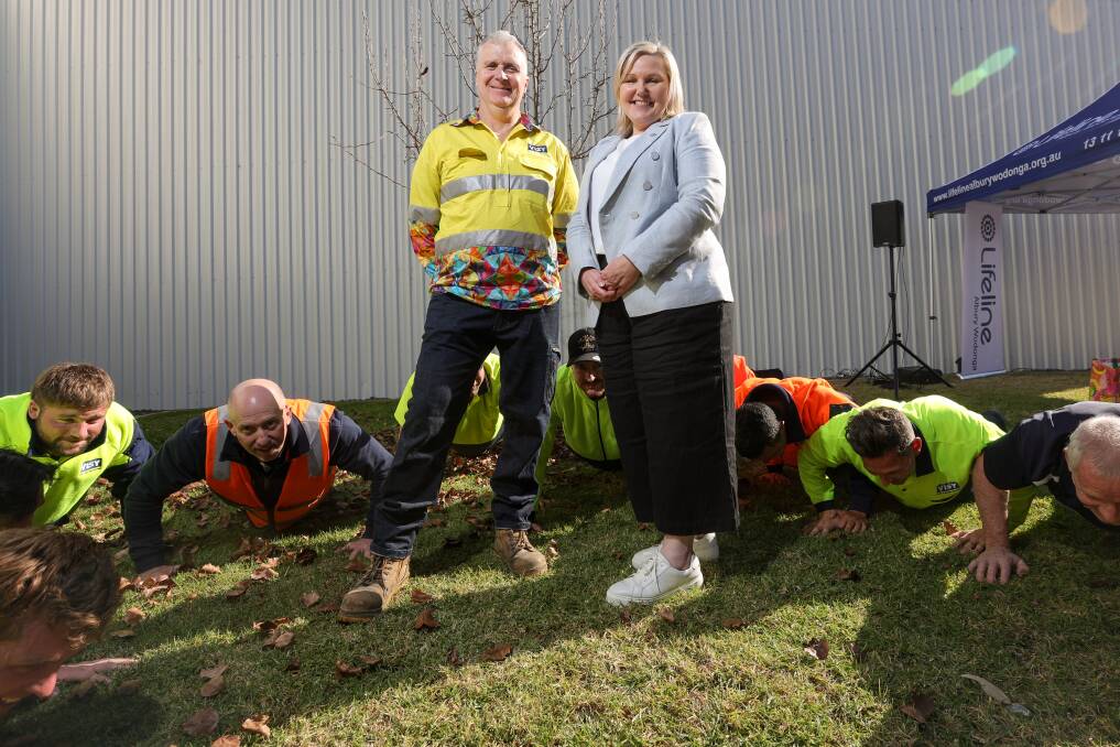 Visy's Chris Myers, mental health first aider on site, with Lifeline Albury-Wodonga's Stacy Read ahead of the push-up challenge. Picture James Wiltshire