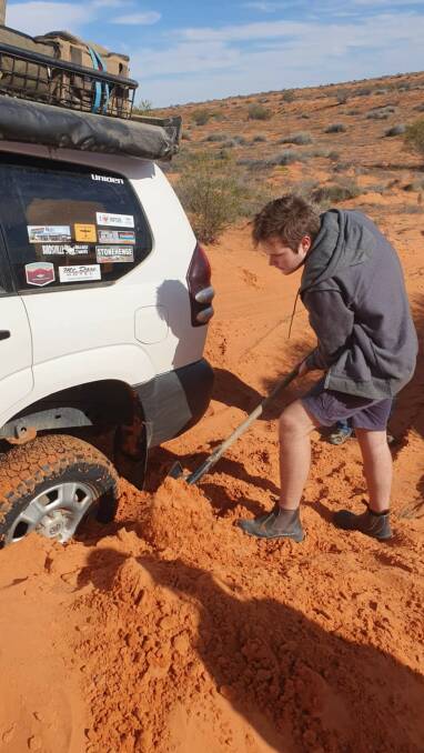 Hands-on experience ... Alec Tait tackles the challenges of four-wheel driving during his recent trip across the Simpson Desert. Picture supplied