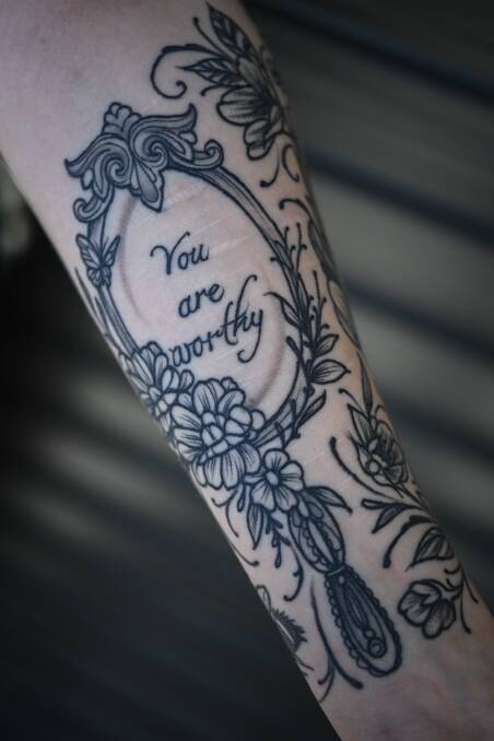 The tattoos etched on Izzy Berry's arm document her journey with an eating disorder. Picture by Mark Jesser