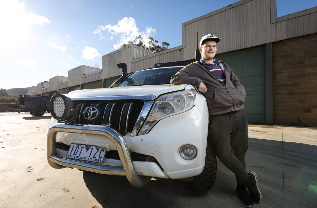 Alec Tait, 17, with the (now slightly battered) Toyota Prado he drove across the Simpson Desert on his L-plates as part of an epic four-wheel drive adventure with his mum Jen. Picture by James Wiltshire