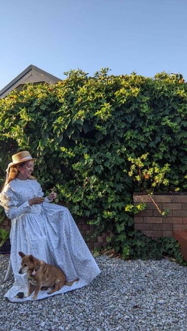 Hollie pictured with her beloved 18-year-old dog Guido, is also a dedicated follower of Victorian era fashion. Picture supplied