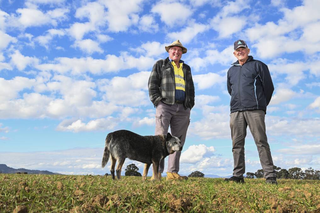 Jindera's Jim Parrett (and his dog Jack) with renowned farming innovator Ray Harrington, who was visiting the Border region from Western Australia recently. Picture by Mark Jesser
