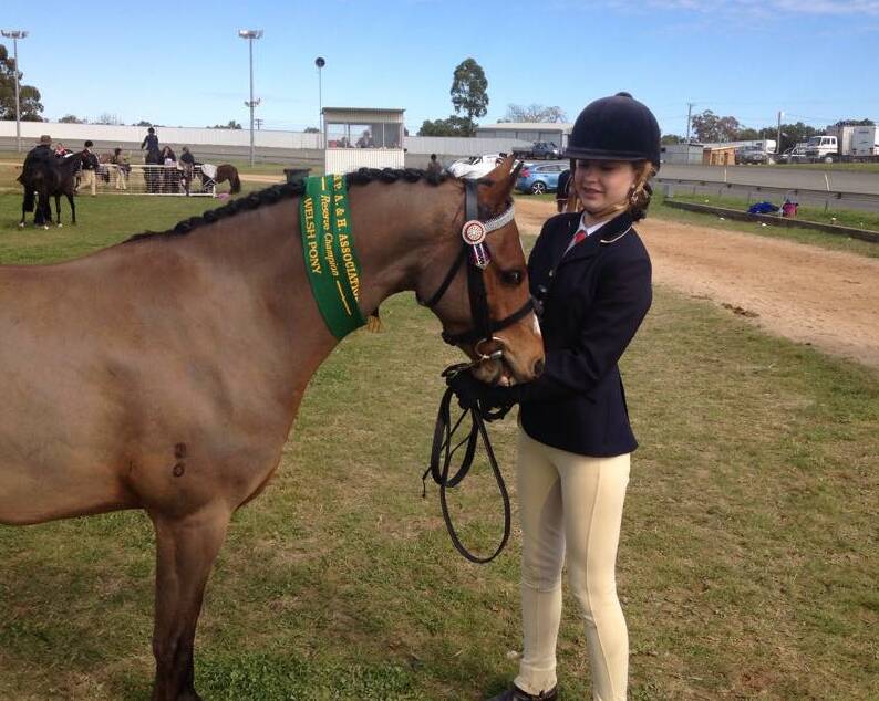 SHOW SUCCESS: Another Chiltern rider, Laticia Van Klaveren, with Bickarton Titan and their reserve champion led riding pony sash at Parkes.