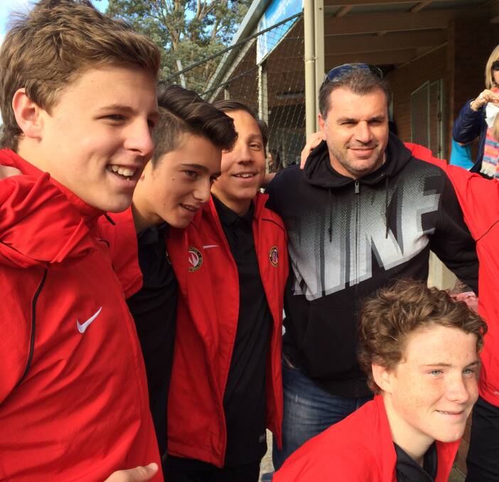 Murray United young guns Fletcher Caponecchia (left) and Jack Milford (front) caught up with Socceroos coach Ange Postecoglou during the season.