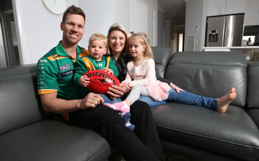 MILESTONE MAN: Dan Leslie relaxes at home with his wife, Karli, and children Duke and Charlize yesterday. Picture: JAMES WILTSHIRE