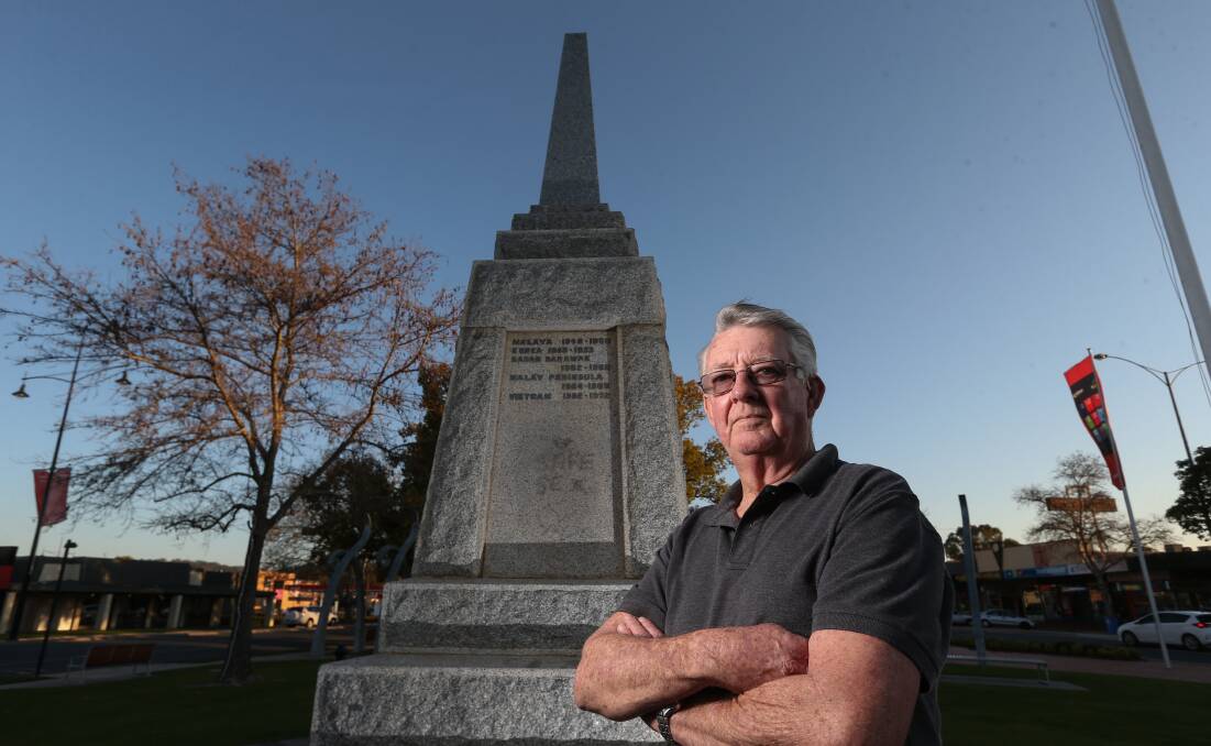 TIME TO MOVE: A reader says it's time to find a new home for Wodonga's war memorial, pictured above with Wodonga RSL president Kevyn Williams.