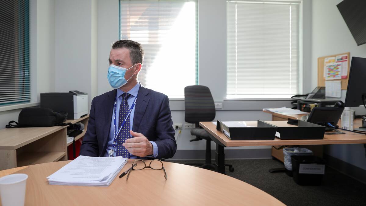 At the table: Albury Wodonga Health chief executive Bill Appleby being interviewed in his office. Picture: JAMES WILTSHIRE