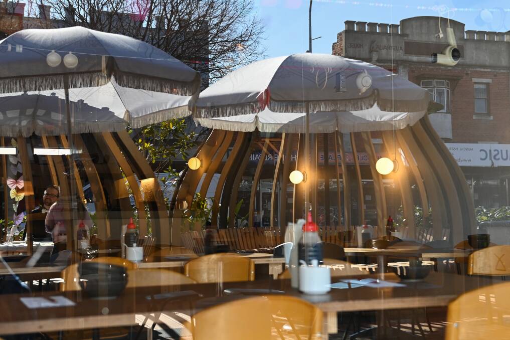 On reflection: The parklets distinctive onion-shaped seating areas are mirrored in windows of Dean Street traders. Picture by Mark Jesser