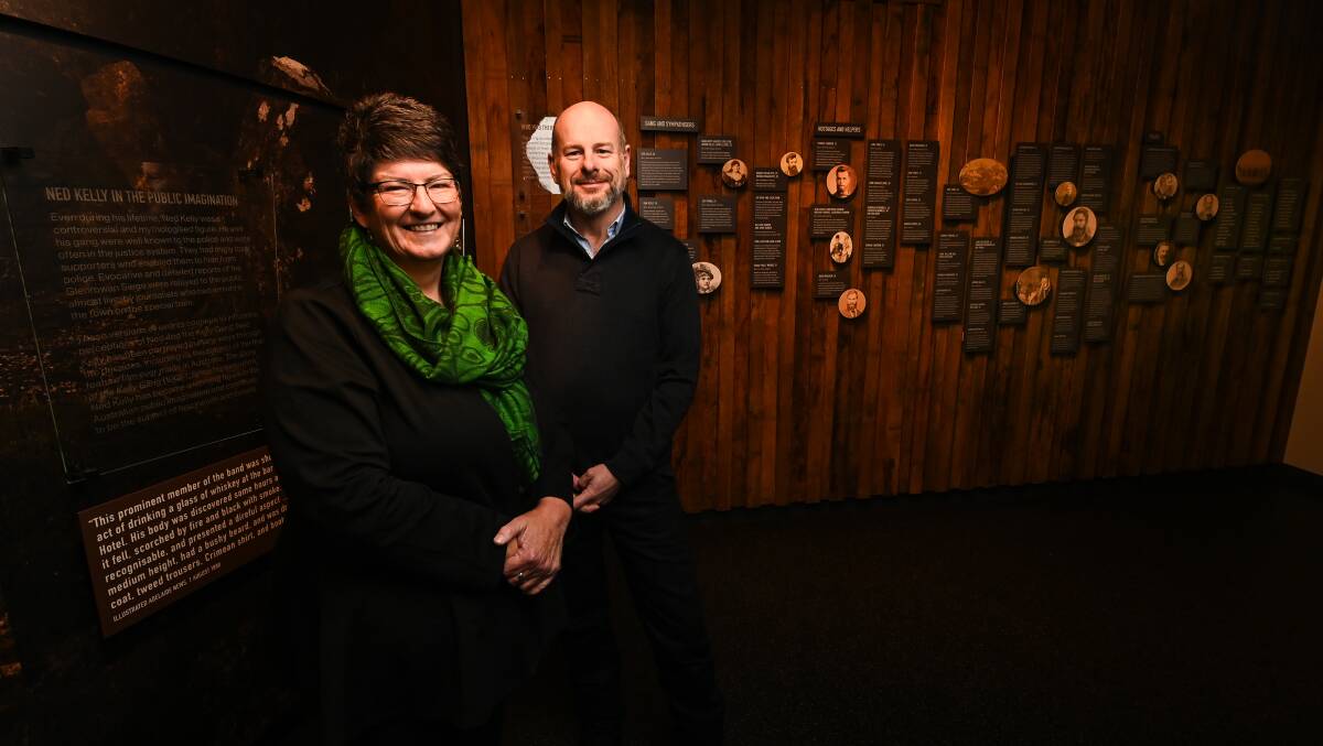 Noeleen Lloyd and Anthony Griffiths in front of a wall which outlines the biographies of the various people involved with or affected by the 1880 siege. Picture by Mark Jesser