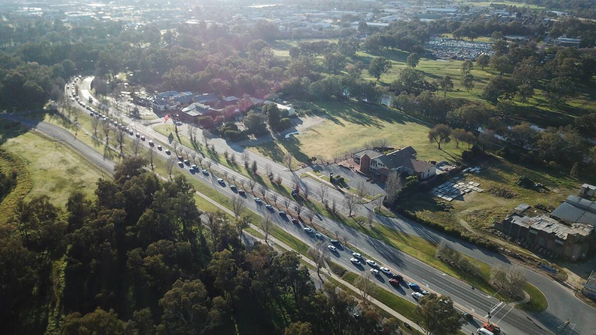 Tail back: Motorists snake back along the Lincoln Causeway on Wednesday following the introduction of a checkpoint at the NSW border.
