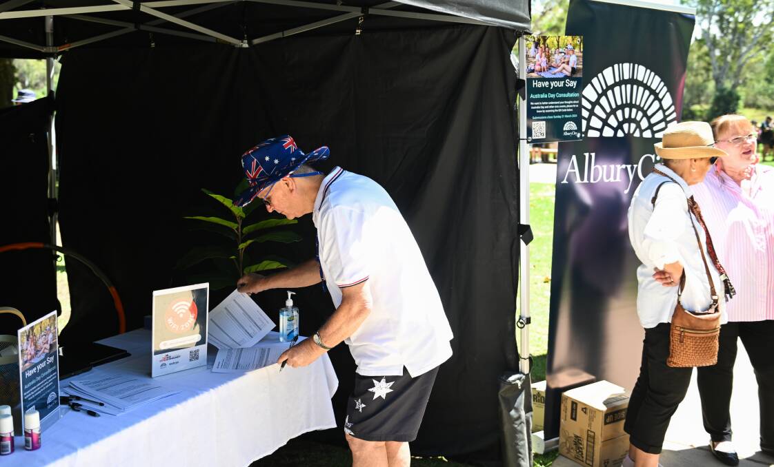 Putting his thoughts down, Wodonga resident Stephen Grimshaw gives his feedback on Albury's Australia Day changes at an information stand. Picture by Mark Jesser