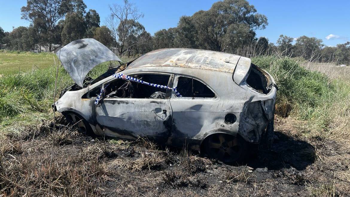 The remains of the Kia coupe which was incinerated about 25 metres from homes in Baxter Court in Lavington.